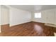 Open living room with hardwood floors and lots of natural light at 10673 Alondra Peak St, Las Vegas, NV 89183
