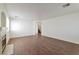 Spacious living room with hardwood floors, neutral walls, fireplace, and staircase at 10673 Alondra Peak St, Las Vegas, NV 89183