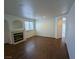 Cozy living room featuring recessed lighting, wood floors, a fireplace, and neutral paint at 10673 Alondra Peak St, Las Vegas, NV 89183