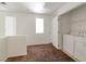 Bright loft area with carpet, natural light, and washer/dryer at 10673 Alondra Peak St, Las Vegas, NV 89183