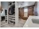 Updated bathroom with a walk-in shower, double sinks, and modern fixtures at 109 Clifton Heights Dr, Las Vegas, NV 89145