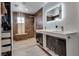 Bathroom featuring double sinks, modern lighting, walk-in shower, and closet space at 109 Clifton Heights Dr, Las Vegas, NV 89145