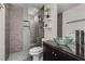 Modern bathroom with glass shower, vessel sink, and gray tiling at 109 Clifton Heights Dr, Las Vegas, NV 89145
