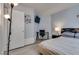 Bedroom with modern lighting, a desk area, and neutral tones at 109 Clifton Heights Dr, Las Vegas, NV 89145