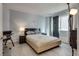 Comfortable bedroom with a queen-sized bed, light gray walls, and stylish lighting at 109 Clifton Heights Dr, Las Vegas, NV 89145