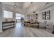Dining room with sleek flooring, stylish lighting, and an open-concept kitchen at 109 Clifton Heights Dr, Las Vegas, NV 89145
