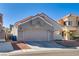 Charming single story home featuring a desert landscape and two car garage at 109 Clifton Heights Dr, Las Vegas, NV 89145