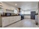 Bright kitchen with white cabinets, stainless steel appliances, and a unique round window at 109 Clifton Heights Dr, Las Vegas, NV 89145
