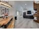 Open-concept dining and living room featuring sleek flooring and modern decor at 109 Clifton Heights Dr, Las Vegas, NV 89145