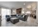 Living room featuring sleek flooring, comfortable sofa, and a decorative fireplace at 109 Clifton Heights Dr, Las Vegas, NV 89145
