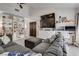 Comfortable living room featuring a comfortable sofa, built-in shelving, and mounted flat screen at 109 Clifton Heights Dr, Las Vegas, NV 89145