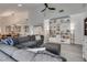 Spacious living room with sleek flooring, built-in shelving, and stylish dining area at 109 Clifton Heights Dr, Las Vegas, NV 89145