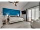 A view of the main bedroom with gray walls and a blue accent wall at 109 Clifton Heights Dr, Las Vegas, NV 89145
