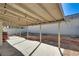 Covered patio area with concrete flooring, surrounded by a block wall and string lights at 109 Clifton Heights Dr, Las Vegas, NV 89145