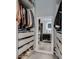 Bright walk-in closet with mirror, custom shelving, drawers and ample storage for clothes and shoes at 109 Clifton Heights Dr, Las Vegas, NV 89145