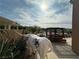 Backyard with a decorative cow statue and relaxing shaded pergola at 1210 Country Club, Laughlin, NV 89029