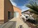 Backyard patio with a decorative cow statue and desert landscaping at 1210 Country Club, Laughlin, NV 89029