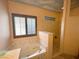 Bathroom featuring a soaking tub, a shower, and natural light from the shuttered windows at 1210 Country Club, Laughlin, NV 89029