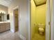 View of the bathroom and the adjacent toilet room with a neutral color scheme at 1210 Country Club, Laughlin, NV 89029