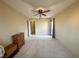 Bedroom with ceiling fan, closet access, carpeted floor, and natural light offers a cozy retreat at 1210 Country Club, Laughlin, NV 89029