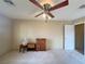 Bedroom features a ceiling fan, carpet, and a cabinet for ample storage and style at 1210 Country Club, Laughlin, NV 89029