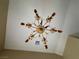 Ornate ceiling chandelier with gold accents and intricate detailing at 1210 Country Club, Laughlin, NV 89029
