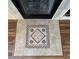 Close-up of a fireplace showing decorative tiles around the firebox adding a touch of elegance at 1210 Country Club, Laughlin, NV 89029