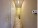 Hallway leading to various rooms, featuring neutral tones and tile flooring, with easy access at 1210 Country Club, Laughlin, NV 89029