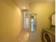 Hallway with a laundry area, leading to other rooms, offering convenience and functionality at 1210 Country Club, Laughlin, NV 89029