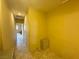 Hallway with neutral walls and tile flooring, offering ample space and access to various rooms at 1210 Country Club, Laughlin, NV 89029