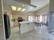Bright kitchen features tile floors, stainless steel appliances, and a cozy breakfast nook at 1210 Country Club, Laughlin, NV 89029