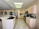 Bright kitchen boasts stainless steel appliances, tile floors, and ample cabinet space at 1210 Country Club, Laughlin, NV 89029