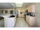 Bright kitchen boasts stainless steel appliances, tile floors, and ample cabinet space at 1210 Country Club, Laughlin, NV 89029