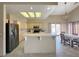 Bright kitchen features tile floors, stainless steel appliances, and a cozy breakfast nook at 1210 Country Club, Laughlin, NV 89029