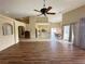 Spacious open-concept living room with wood floors flows into the kitchen and dining area at 1210 Country Club, Laughlin, NV 89029
