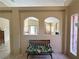 Open living space with dual arched openings providing natural light and architectural interest at 1210 Country Club, Laughlin, NV 89029