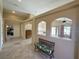 Open living space with dual arched openings providing natural light and architectural interest at 1210 Country Club, Laughlin, NV 89029