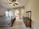 Bedroom featuring neutral carpet, plantation shutters, with access to a Primary bath at 1210 Country Club, Laughlin, NV 89029