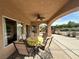 Inviting covered patio with comfortable seating and a ceiling fan, perfect for outdoor dining at 1210 Country Club, Laughlin, NV 89029