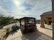 Backyard pergola featuring a hot tub and ample space for lounging at 1210 Country Club, Laughlin, NV 89029
