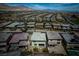 Aerial view showcases a neighborhood and homes with stunning mountain views beyond at 12495 Point Sierra St, Las Vegas, NV 89138