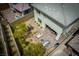 Aerial view of a private backyard with a patio, fire pit, and desert landscaping at 12495 Point Sierra St, Las Vegas, NV 89138