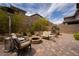 Inviting backyard features a fire pit, cozy seating, and mature trees at 12495 Point Sierra St, Las Vegas, NV 89138
