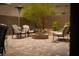 Inviting backyard featuring a fire pit, lounge chairs, and desert landscaping at 12495 Point Sierra St, Las Vegas, NV 89138
