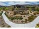 The Bixby Creek community entrance features attractive landscaping and stone signage at 12495 Point Sierra St, Las Vegas, NV 89138