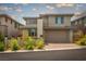 Contemporary two-story home with a two-car garage and well-maintained landscaping at 12495 Point Sierra St, Las Vegas, NV 89138