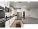 Modern kitchen featuring white cabinetry, stainless steel appliances, and a large center island at 12495 Point Sierra St, Las Vegas, NV 89138