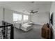 Upstairs loft area with comfortable seating and a modern ceiling fan at 12495 Point Sierra St, Las Vegas, NV 89138