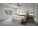 Bright main bedroom featuring plush carpeting and neutral decor at 12495 Point Sierra St, Las Vegas, NV 89138
