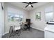 Home office space with large window, neutral walls, and overhead fan at 12495 Point Sierra St, Las Vegas, NV 89138
